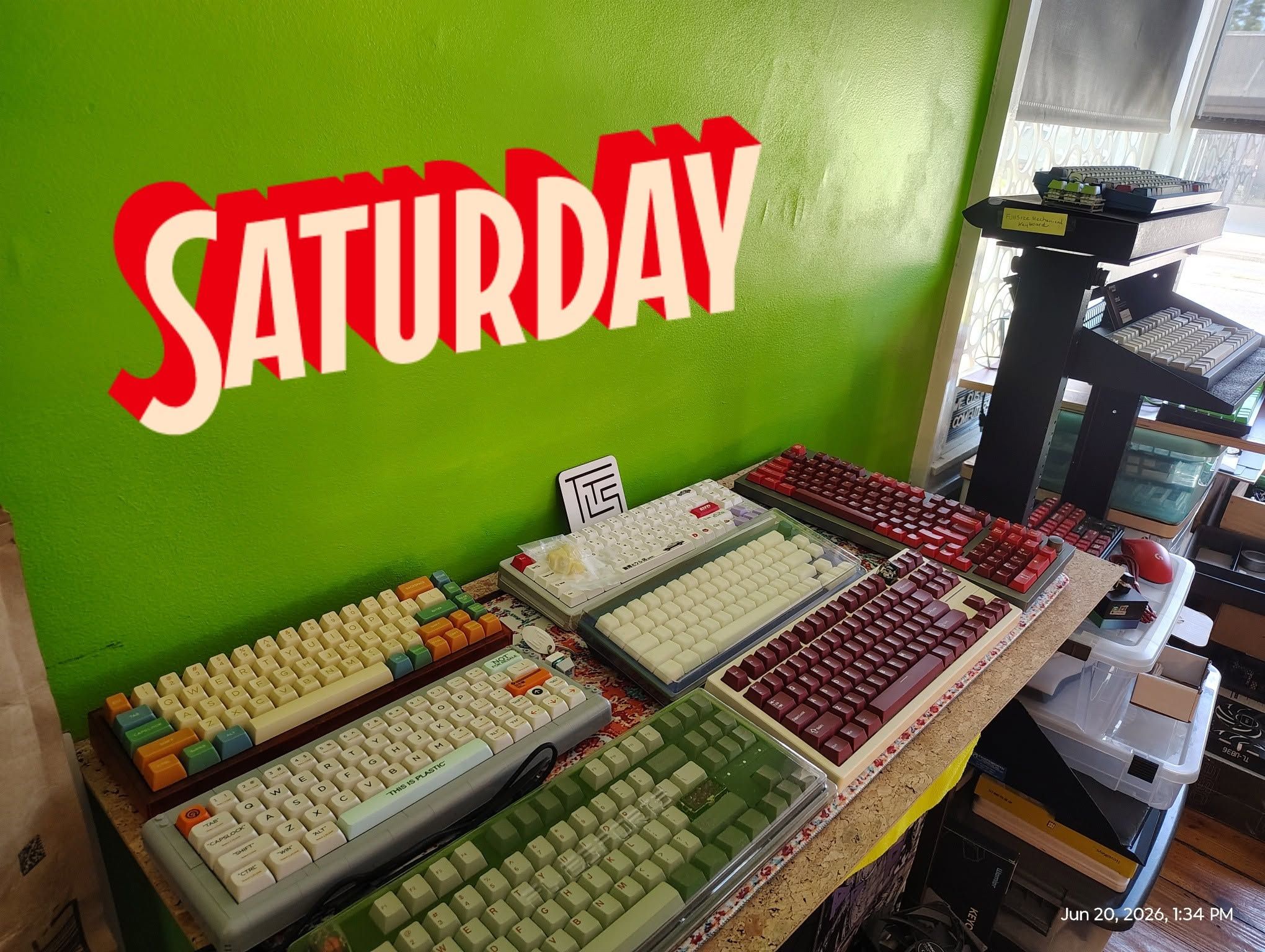 A table covered with mechanical keyboards at the June 2026 meetup